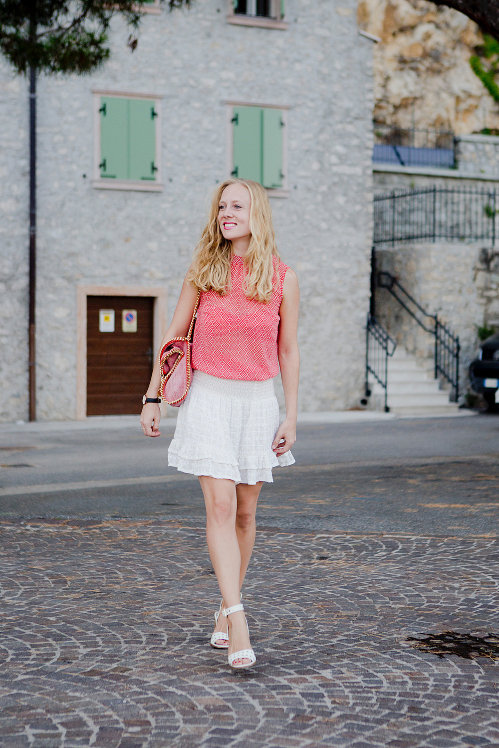 summer look with white skirt white sandals stella mccartney falabella